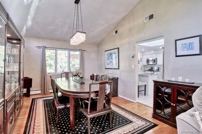Chandelier, Dining room, Interior, Kitchen, Pendant Lights, Stainless Steel Appliances, Wood Texture Flooring