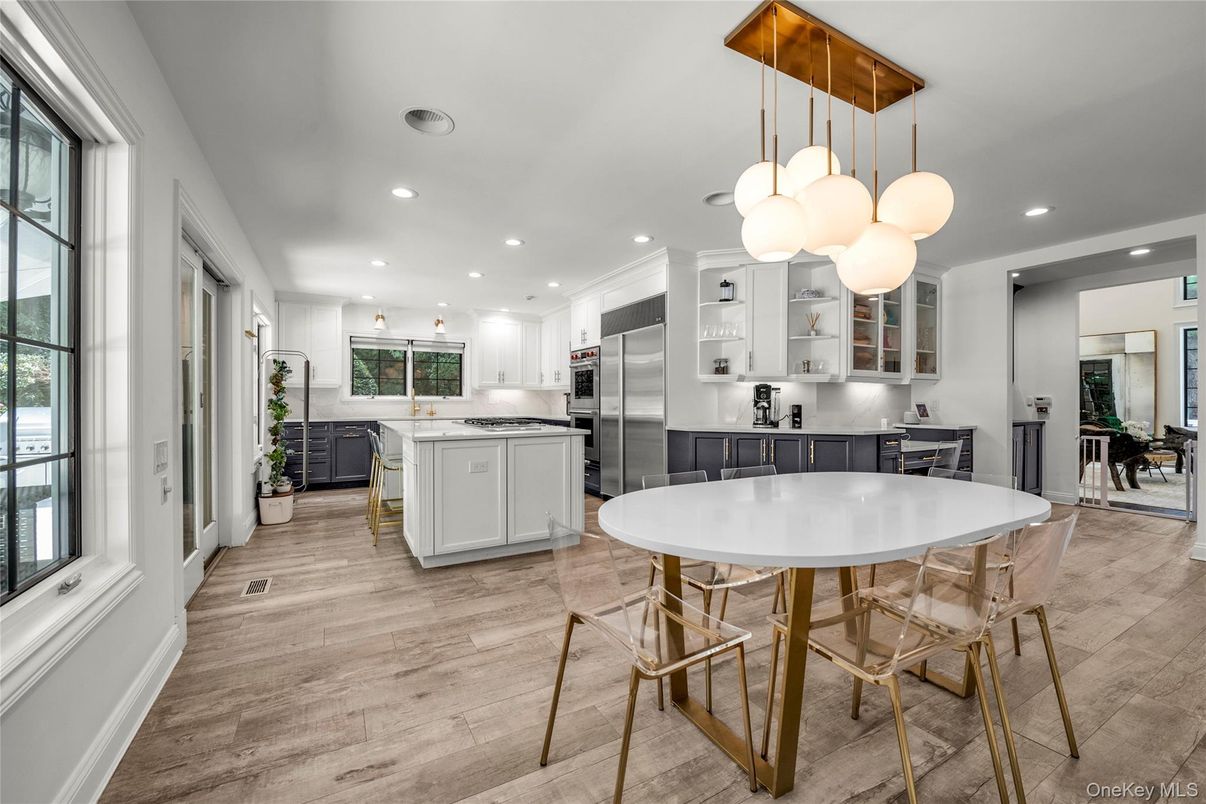 Dining room, Interior, Kitchen, Pendant Lights, Recessed Lighting, Stainless Steel Appliances, Wood Texture Flooring
