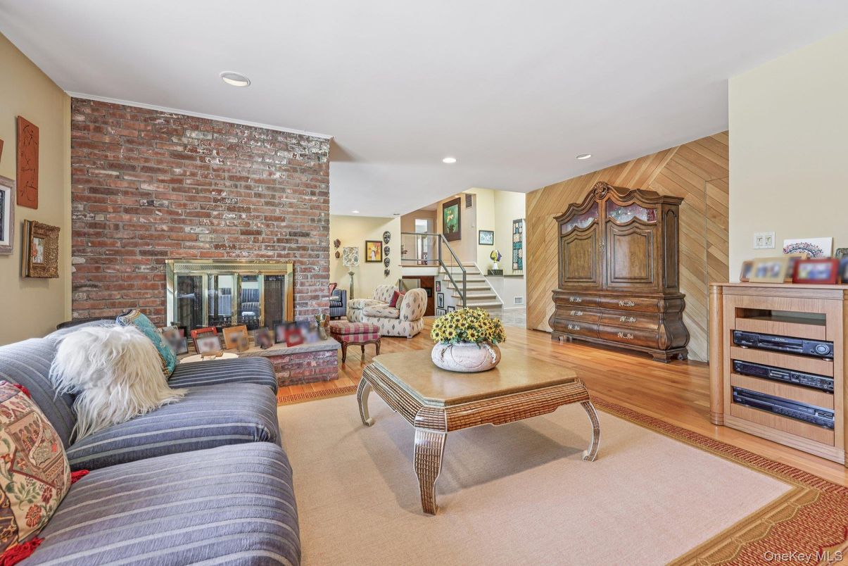 Fireplace, Interior, Living room, Recessed Lighting, Stone Walls, Wood Texture Flooring