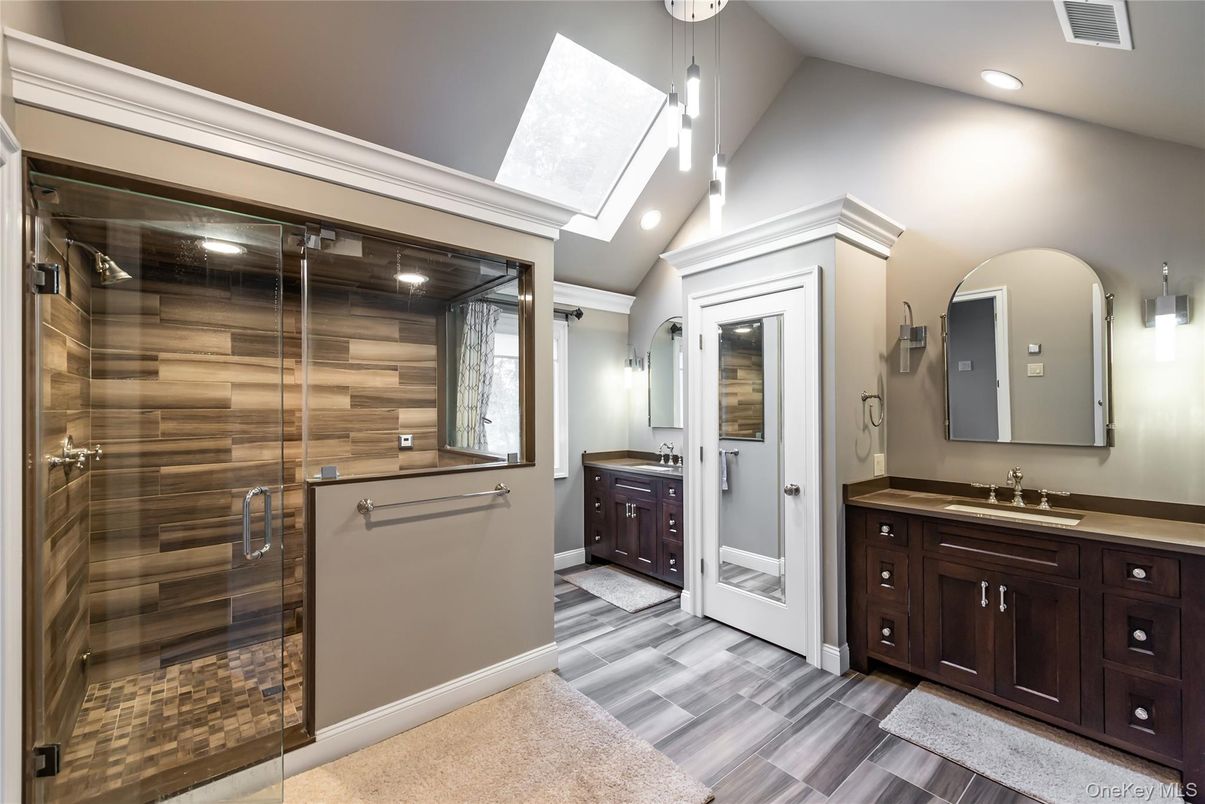 Bathroom, Dual Sink Vanities, Glass Shower, Interior, Pendant Lights, Recessed Lighting, Wood Texture Flooring