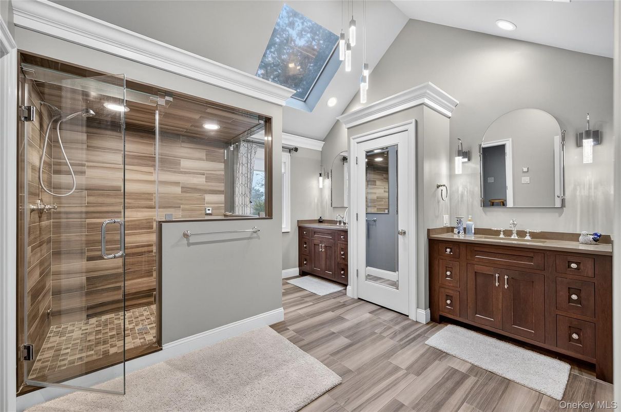 Bathroom, Dual Sink Vanities, Glass Shower, Interior, Pendant Lights, Recessed Lighting, Wood Texture Flooring