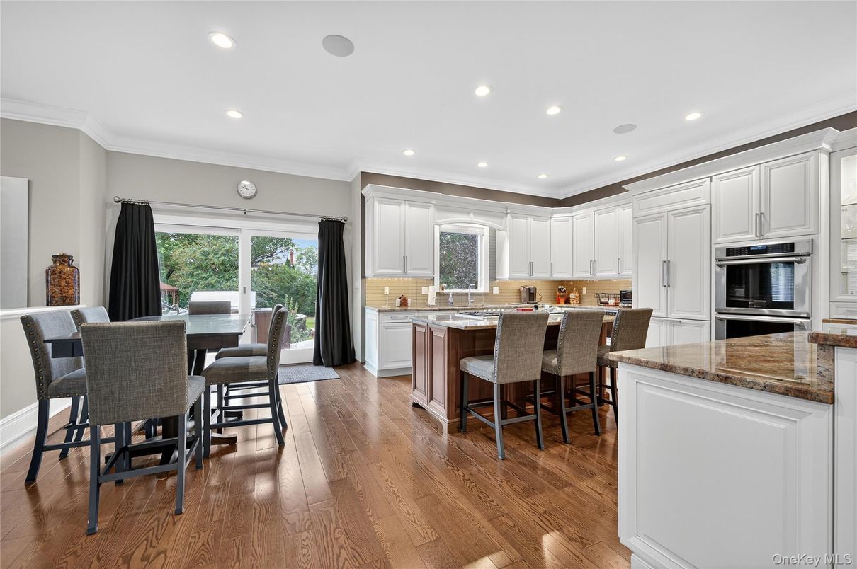 Dining room, Interior, Kitchen, Recessed Lighting, Stainless Steel Appliances, Wood Texture Flooring