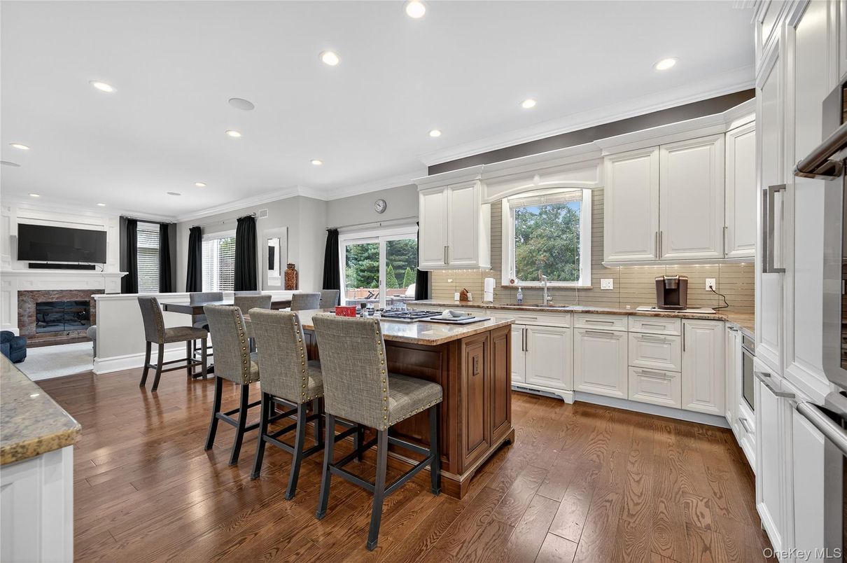 Dining room, Fireplace, Interior, Kitchen, Recessed Lighting, Wood Texture Flooring