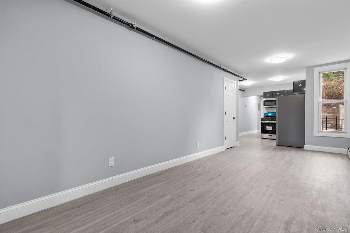 Empty room, Interior, Kitchen, Stainless Steel Appliances, Wood Texture Flooring