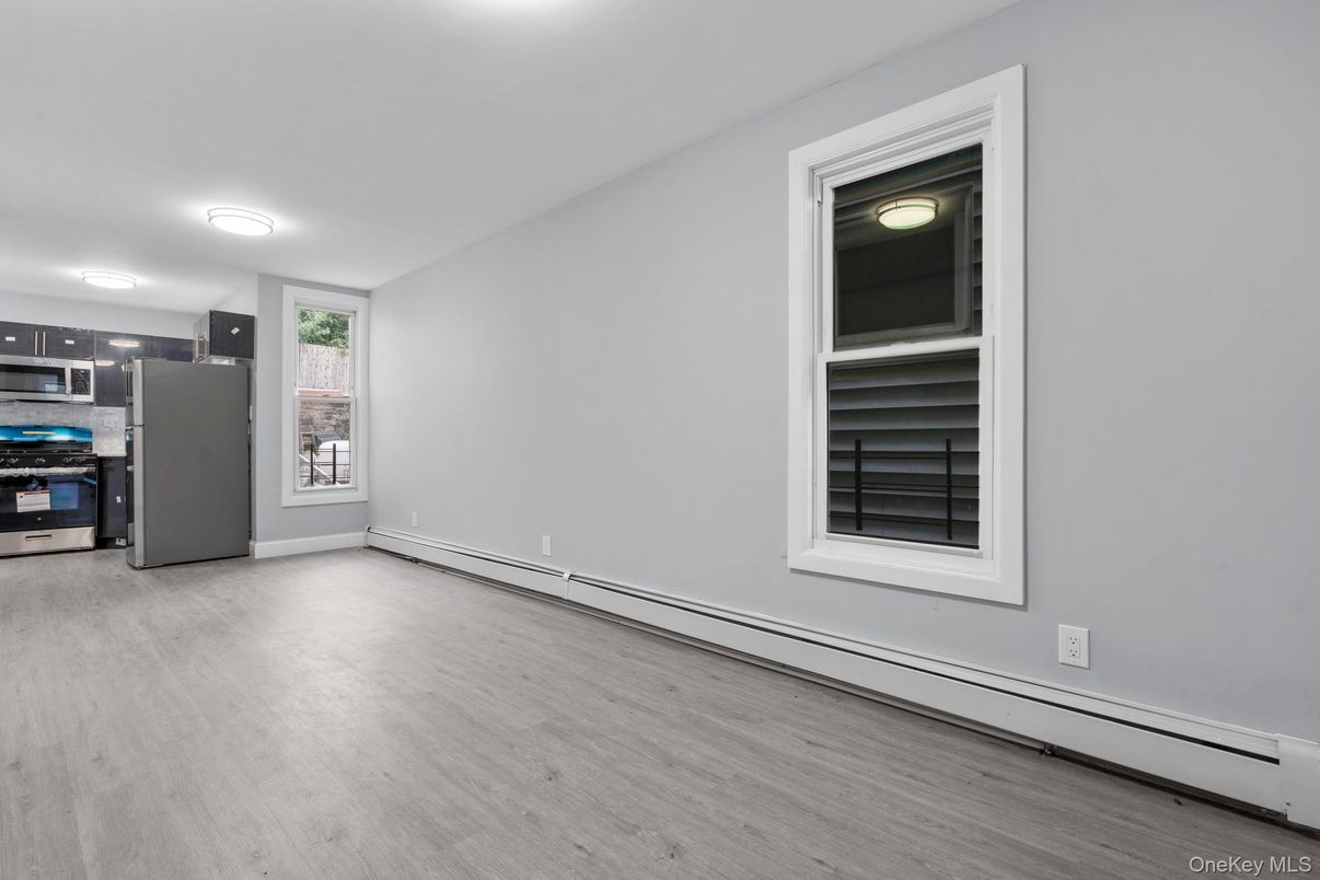 Empty room, Interior, Kitchen, Stainless Steel Appliances, Wood Texture Flooring