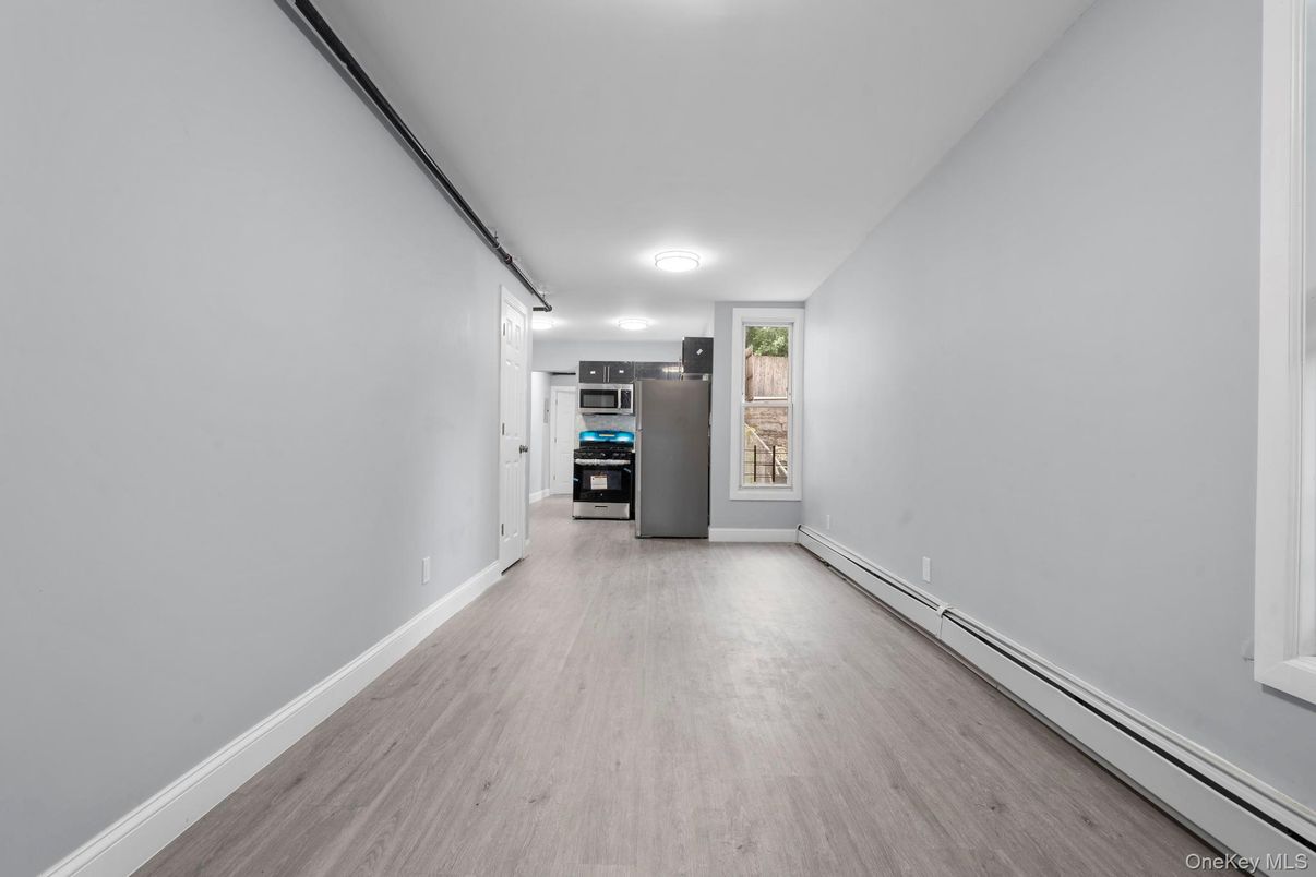 Empty room, Interior, Kitchen, Stainless Steel Appliances, Wood Texture Flooring