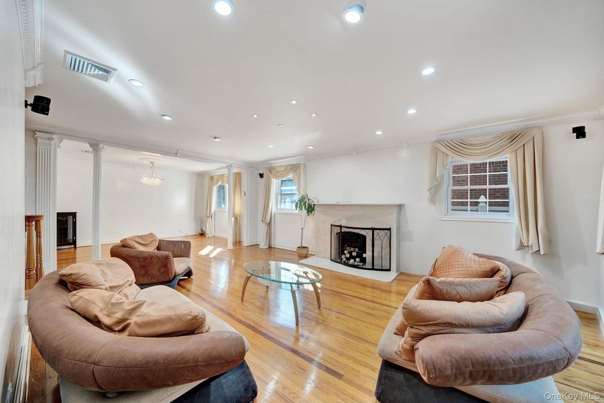 Chandelier, Fireplace, Interior, Living room, Recessed Lighting, Wood Texture Flooring