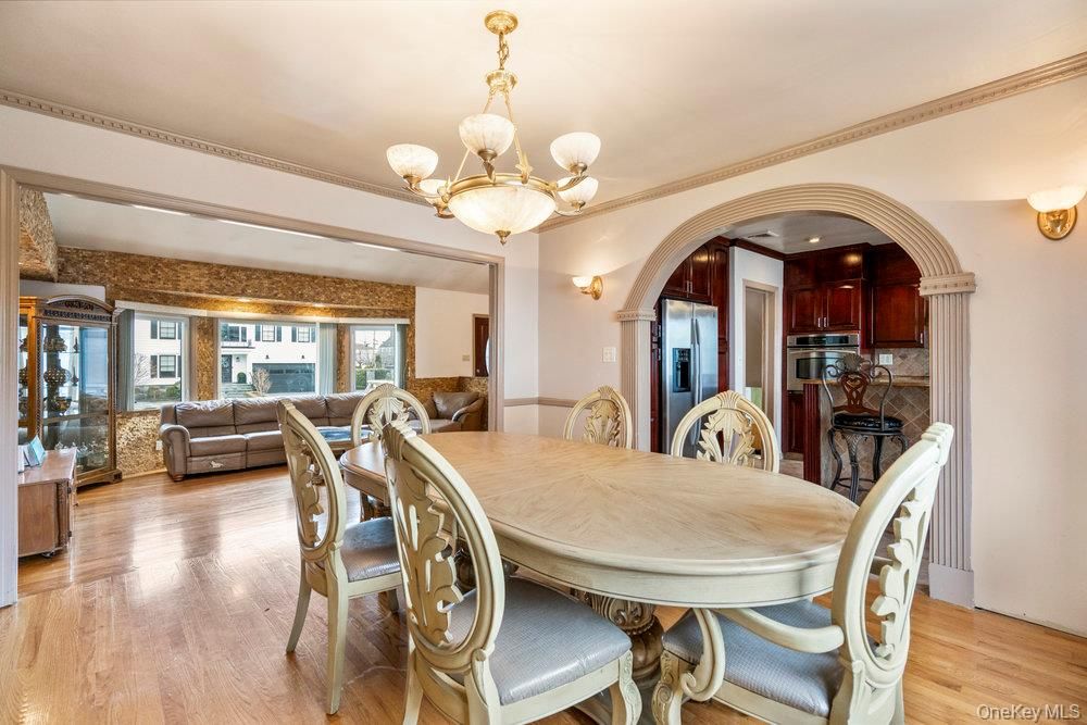 Chandelier, Dining room, Interior, Kitchen, Living room, Stainless Steel Appliances, Wood Texture Flooring