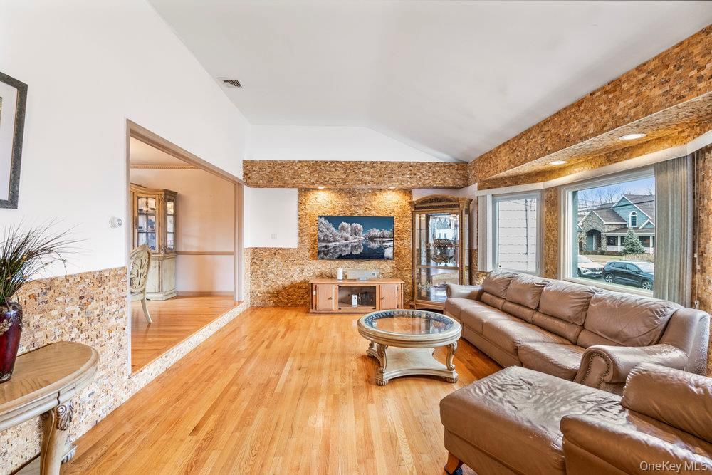 Fireplace, Interior, Living room, Recessed Lighting, Stone Walls, Wood Texture Flooring