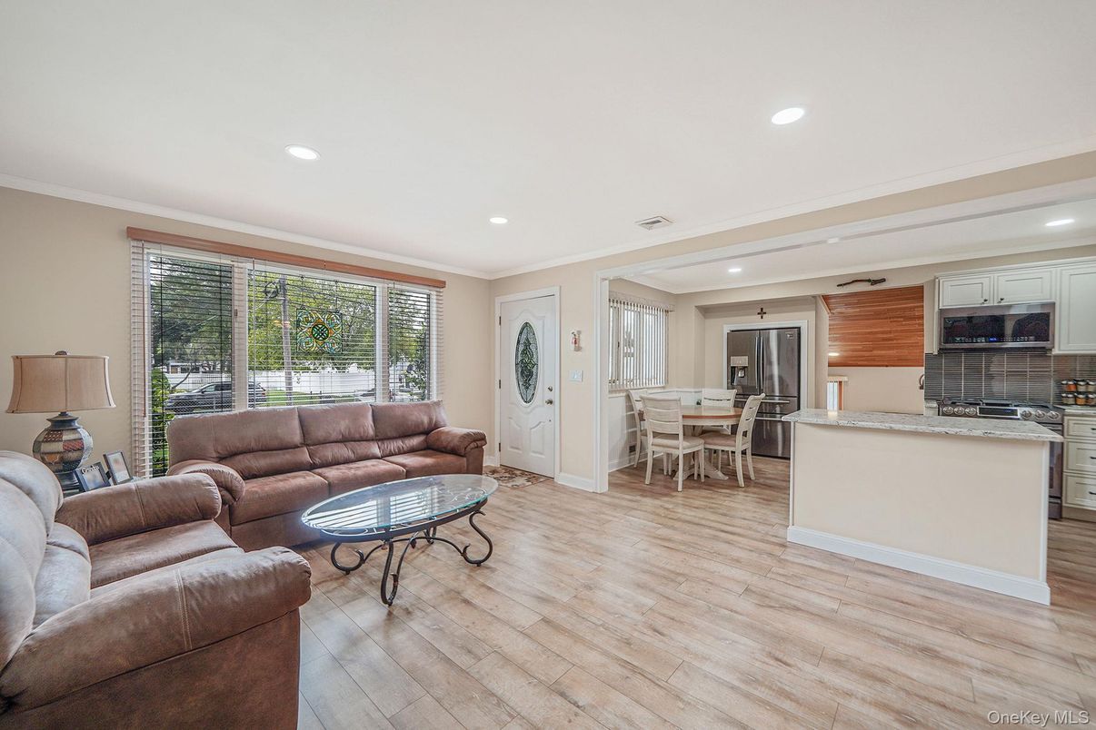Dining room, Interior, Kitchen, Living room, Recessed Lighting, Stainless Steel Appliances, Wood Texture Flooring