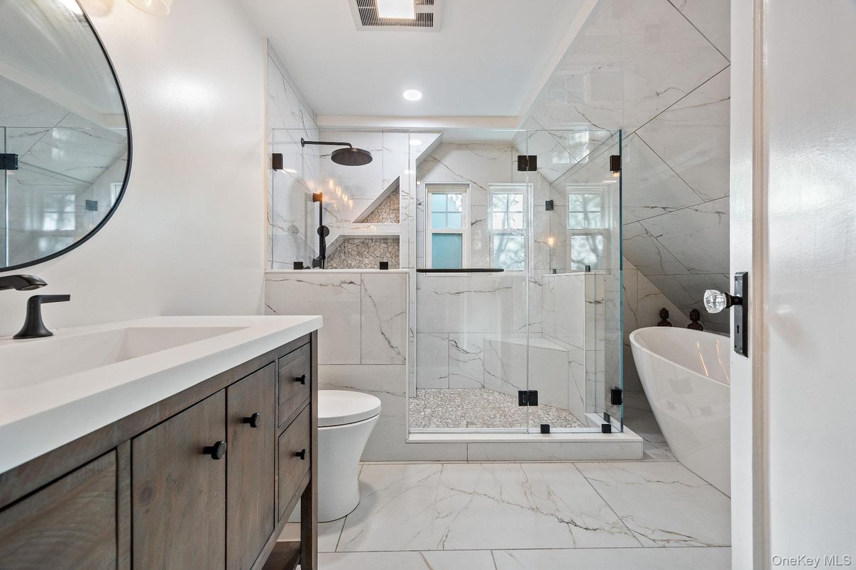 Bathroom, Dual Sink Vanities, Free Standing Baths, Glass Shower, Interior, Marble, Marble Walls, Recessed Lighting