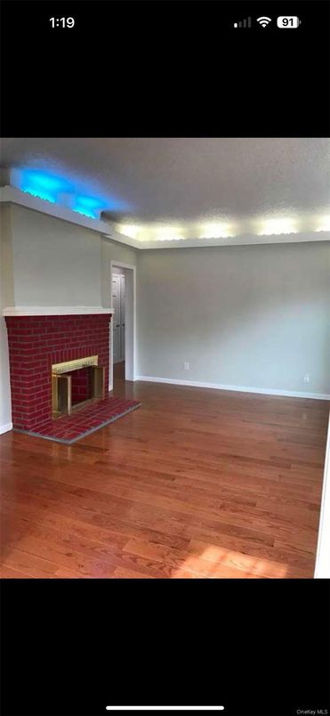 Empty room, Fireplace, Interior, Recessed Lighting, Wood Texture Flooring