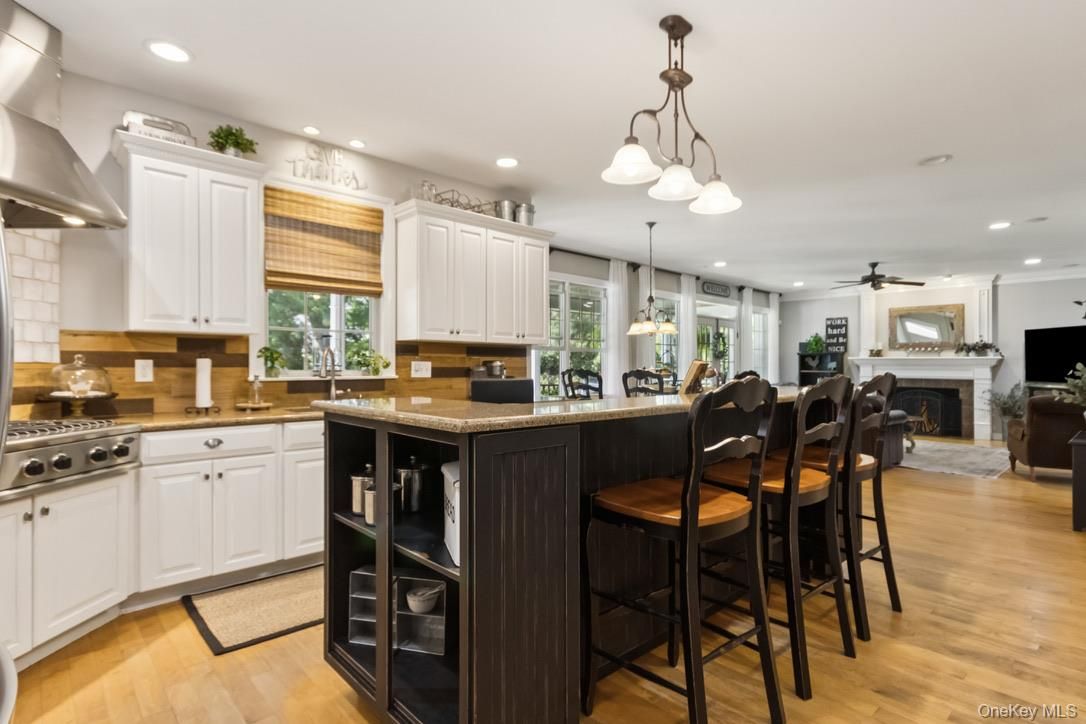 Fireplace, Interior, Kitchen, Pendant Lights, Recessed Lighting, Stainless Steel Appliances, Wood Texture Flooring