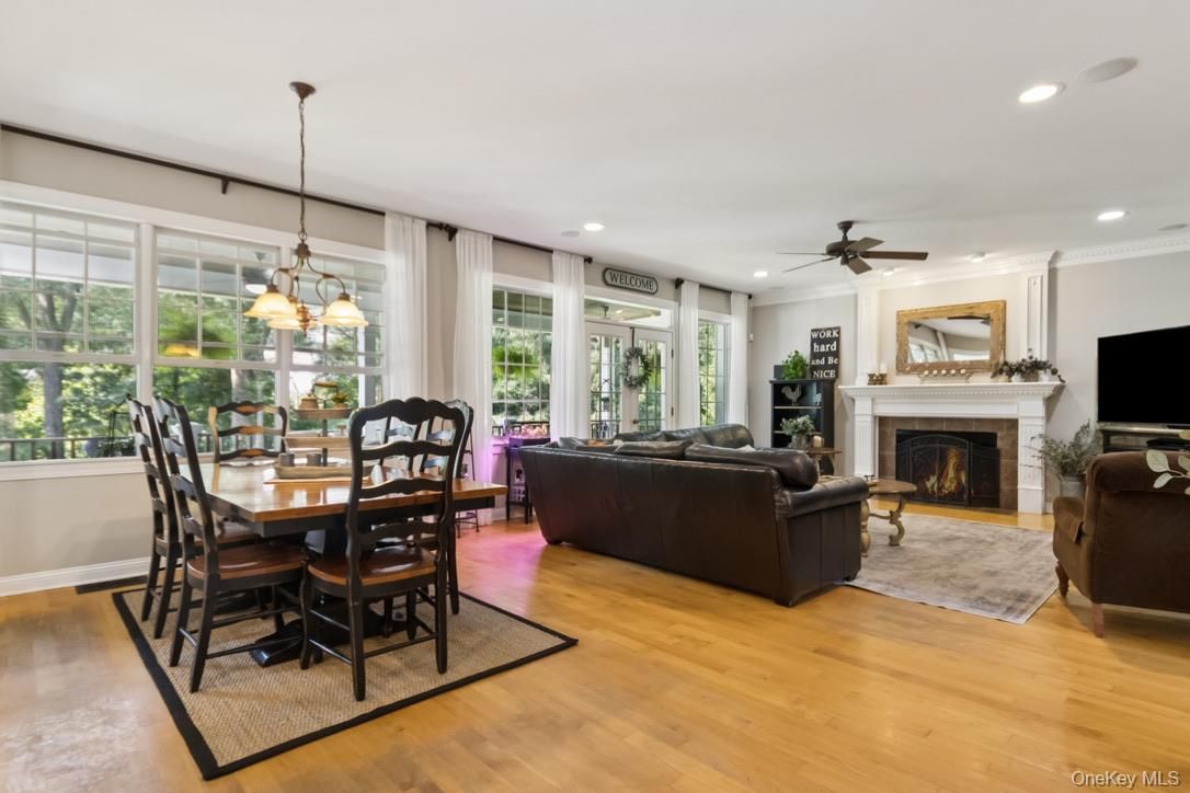 Dining room, Fireplace, Interior, Living room, Pendant Lights, Recessed Lighting, Wood Texture Flooring