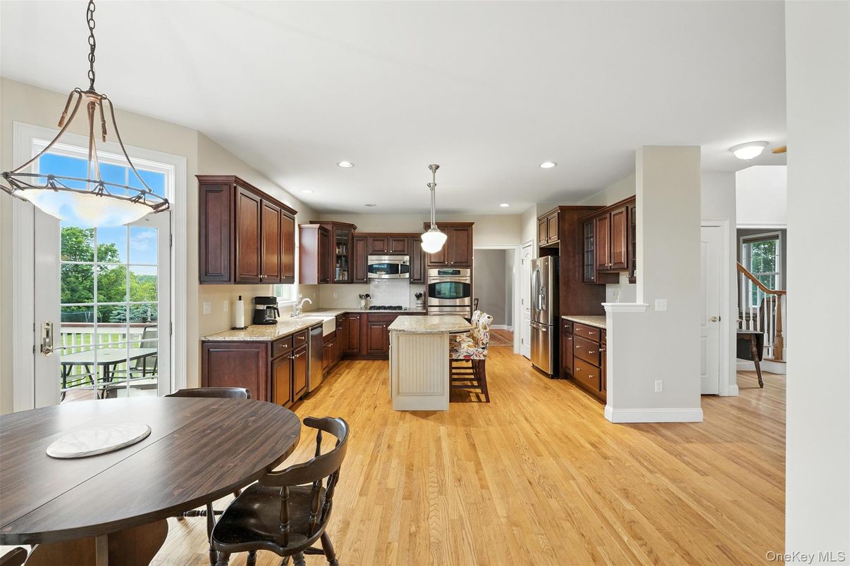 Dining room, Interior, Kitchen, Pendant Lights, Recessed Lighting, Stainless Steel Appliances, Wood Texture Flooring