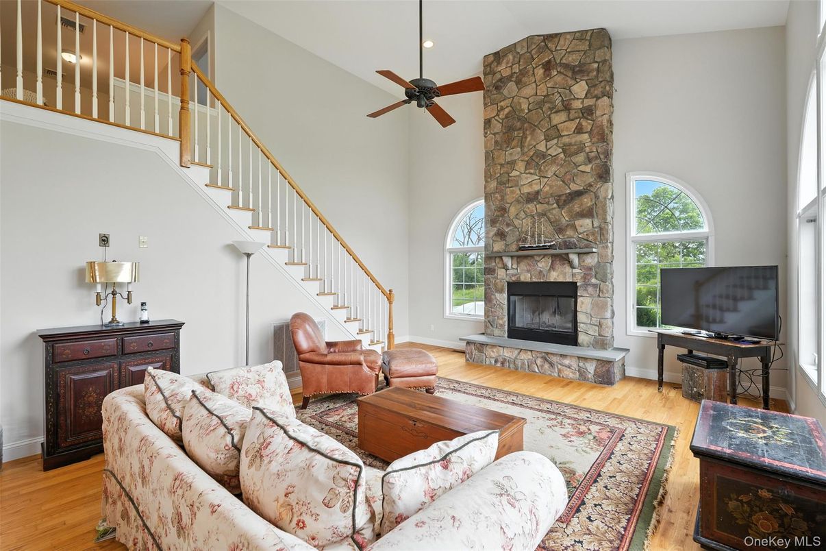 Fireplace, Interior, Living room, Recessed Lighting, Stone Walls, Wood Texture Flooring