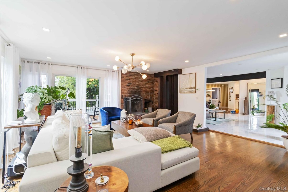 Fireplace, Interior, Living room, Pendant Lights, Recessed Lighting, Stone Walls, Wood Texture Flooring