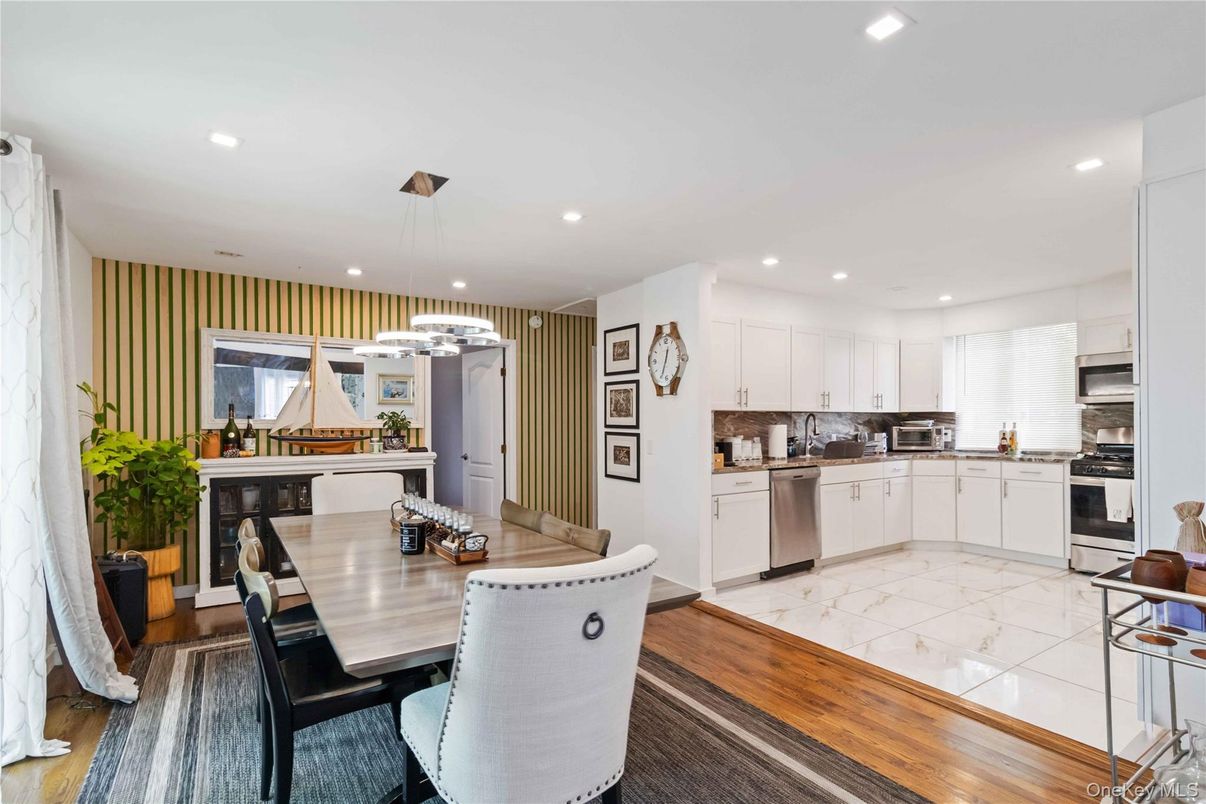 Dining room, Interior, Kitchen, Marble, Pendant Lights, Recessed Lighting, Stainless Steel Appliances, Wood Texture Flooring