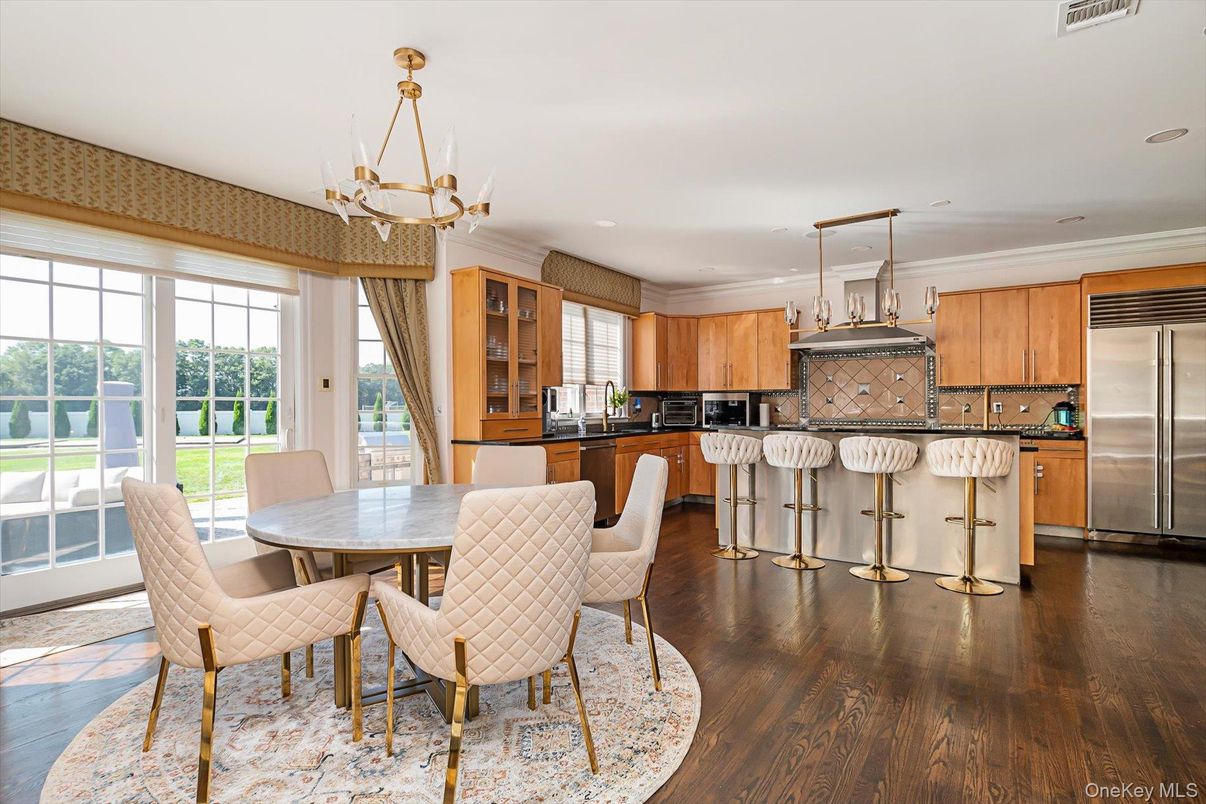 Chandelier, Dining room, Interior, Kitchen, Recessed Lighting, Stainless Steel Appliances, Wood Texture Flooring