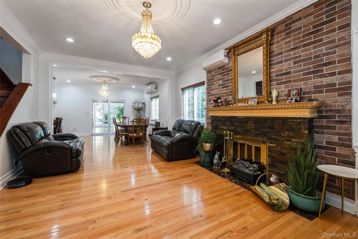 Chandelier, Dining room, Fireplace, Interior, Recessed Lighting, Stone Walls, Wood Texture Flooring
