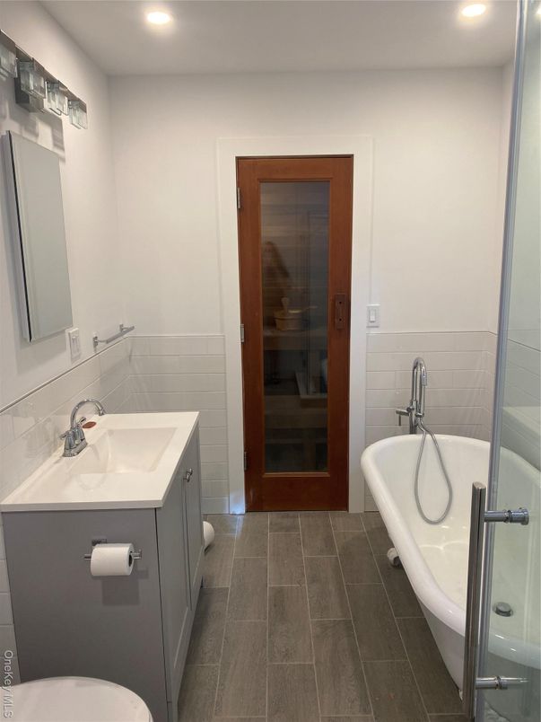 Bathroom, Dual Sink Vanities, Free Standing Baths, Glass Shower, Interior, Recessed Lighting, Sauna Room