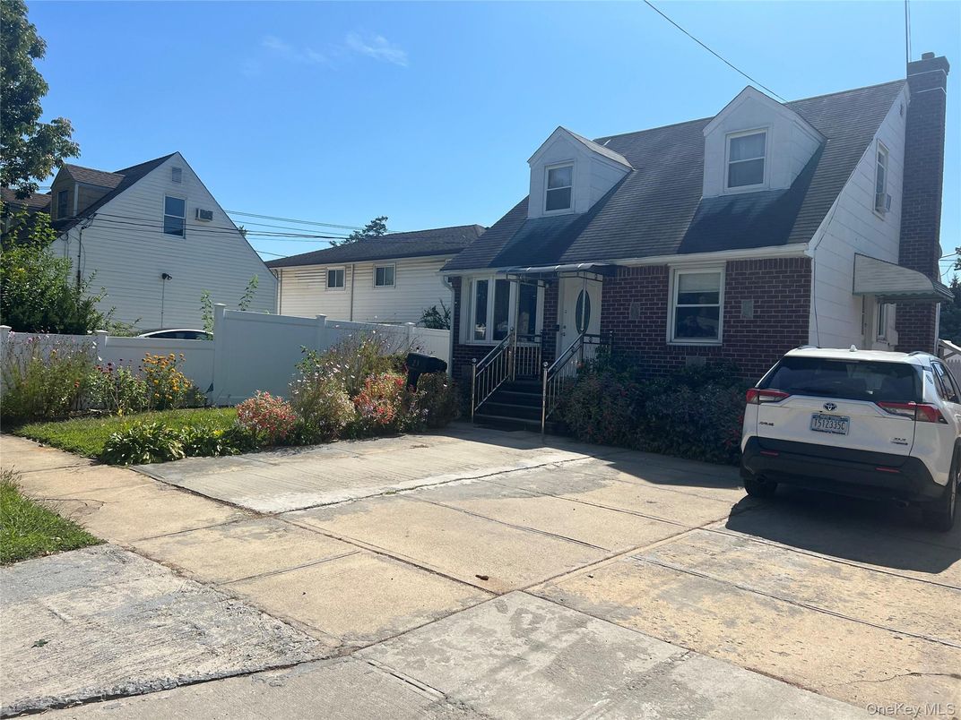 Exterior, Facade, Brick Facade, Cape Cod