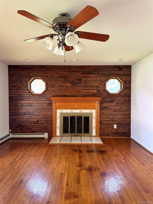 Empty room, Fireplace, Interior, Recessed Lighting, Wood Texture Flooring, Wooden Walls
