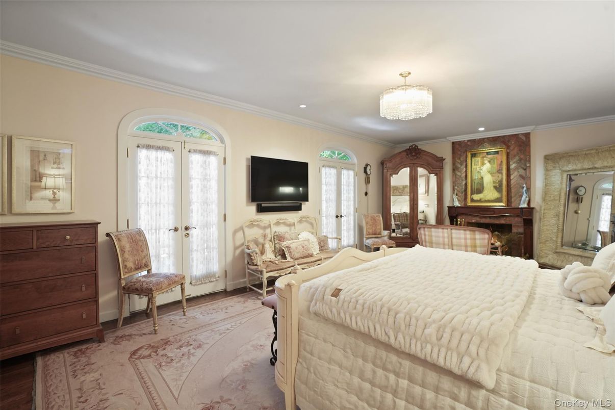 Bedroom, Chandelier, Fireplace, Interior, Recessed Lighting, Wood Texture Flooring