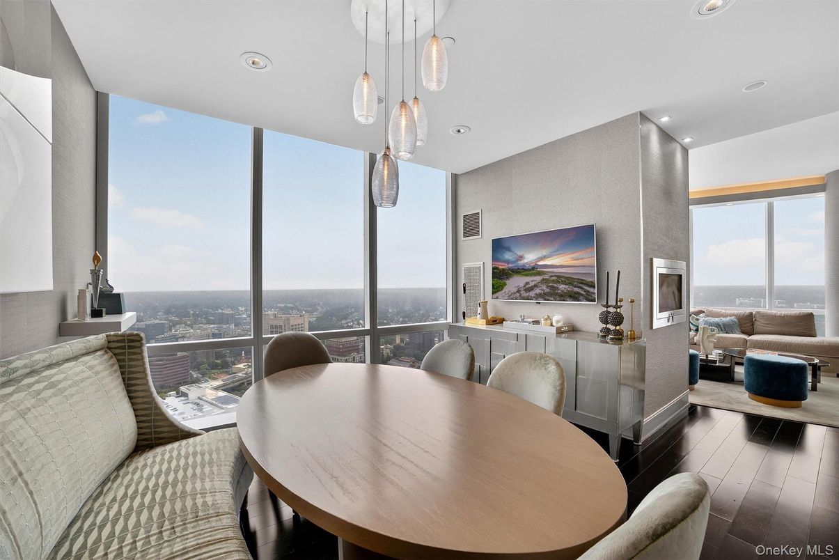 Dining room, Fireplace, Interior, Living room, Pendant Lights, Recessed Lighting, Water, Wood Texture Flooring