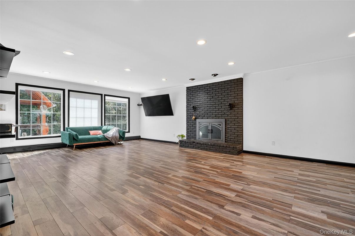 Empty room, Fireplace, Interior, Recessed Lighting, Stone Walls, Wood Texture Flooring