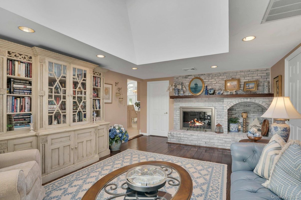 Fireplace, Interior, Living room, Recessed Lighting, Stone Walls, Wood Texture Flooring
