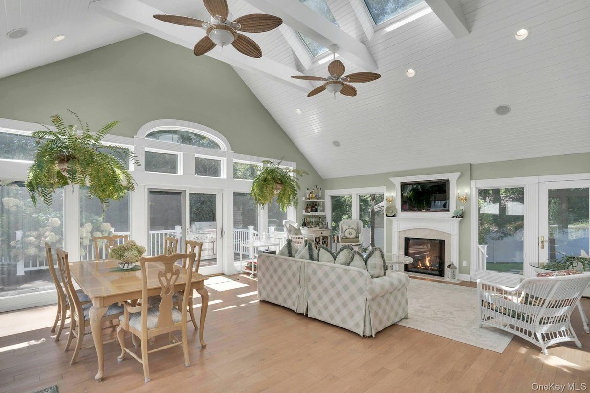 Dining room, Fireplace, Interior, Living room, Recessed Lighting, Sun Room, Wood Texture Flooring