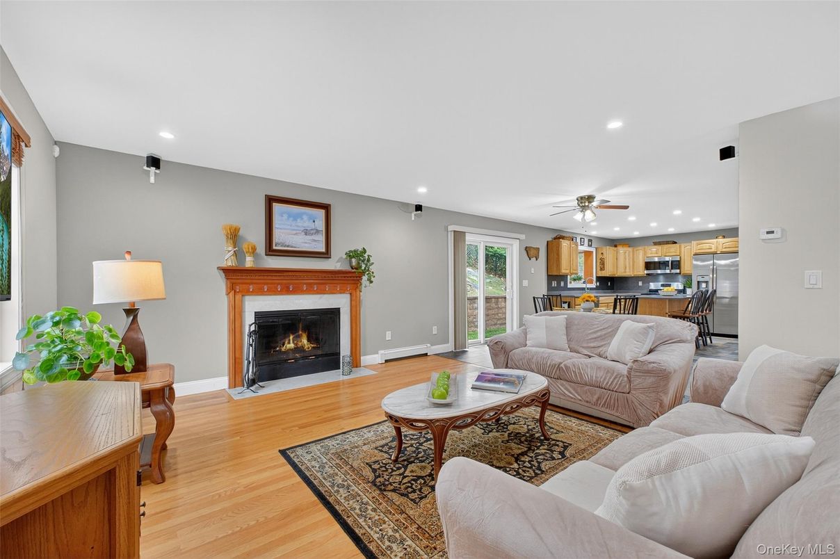 Fireplace, Interior, Kitchen, Living room, Pendant Lights, Recessed Lighting, Stainless Steel Appliances, Wood Texture Flooring