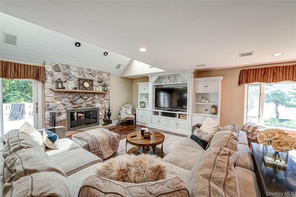 Fireplace, Interior, Living room, Recessed Lighting, Stone Walls, Wood Texture Flooring