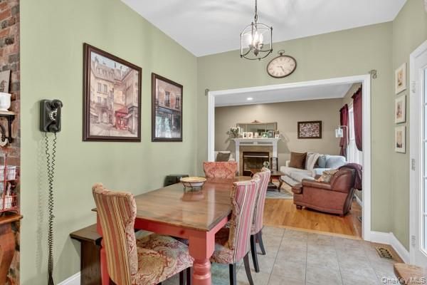 Dining room, Fireplace, Interior, Living room, Pendant Lights, Recessed Lighting, Wood Texture Flooring
