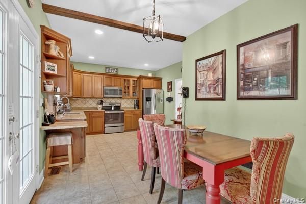 Chandelier, Dining room, Interior, Kitchen, Pendant Lights, Recessed Lighting, Stainless Steel Appliances, Wooden Beams
