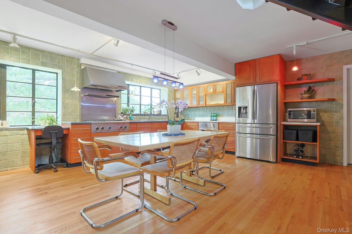 Dining room, Interior, Kitchen, Pendant Lights, Stainless Steel Appliances, Stone Walls, Wood Texture Flooring