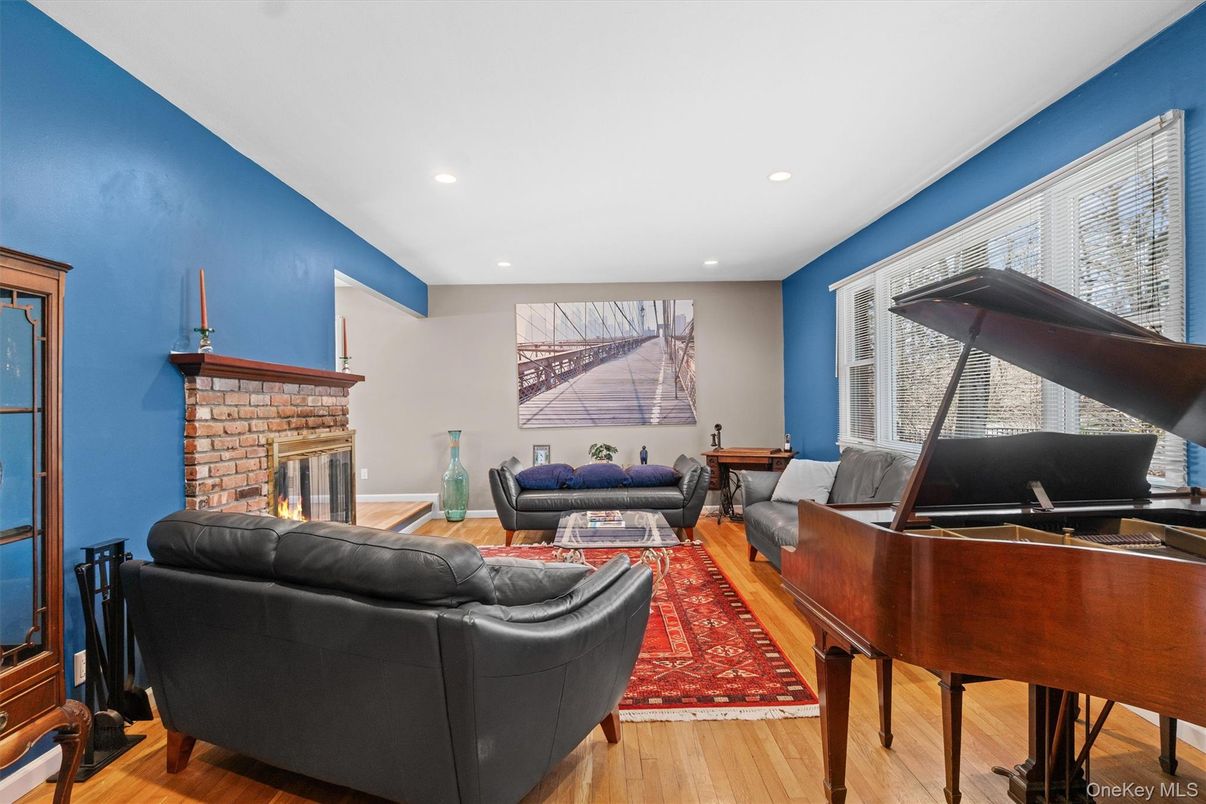 Fireplace, Interior, Living room, Piano, Recessed Lighting, Wood Texture Flooring