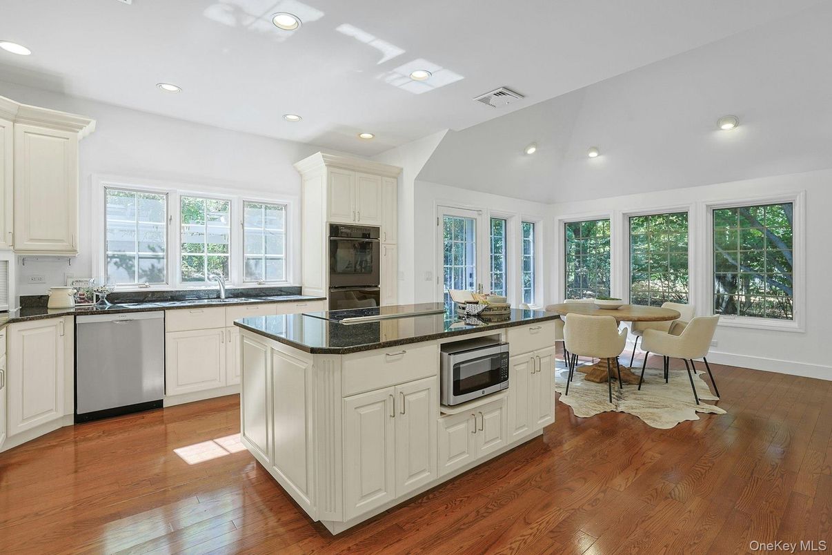 Dining room, Interior, Kitchen, Recessed Lighting, Stainless Steel Appliances, Wood Texture Flooring