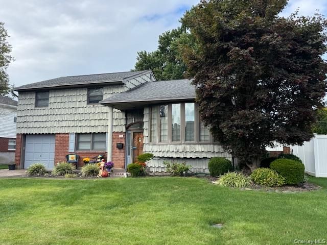 Attached, Backyard, Exterior, Facade, Brick Facade, Split Level