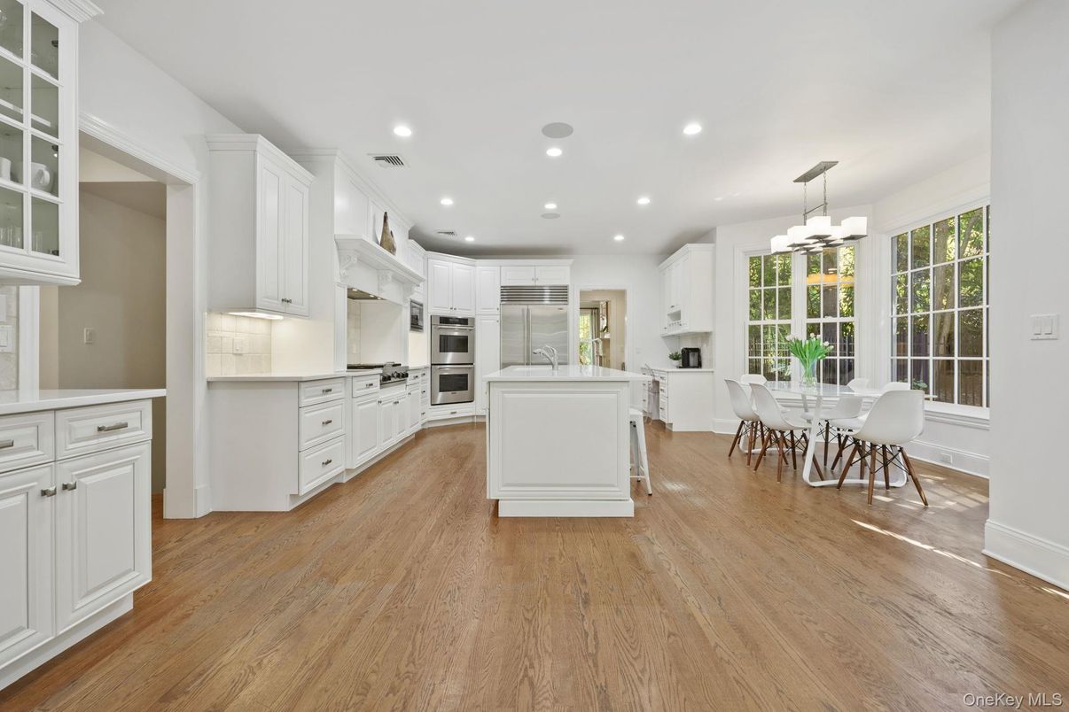 Dining room, Interior, Kitchen, Pendant Lights, Recessed Lighting, Stainless Steel Appliances, Wood Texture Flooring