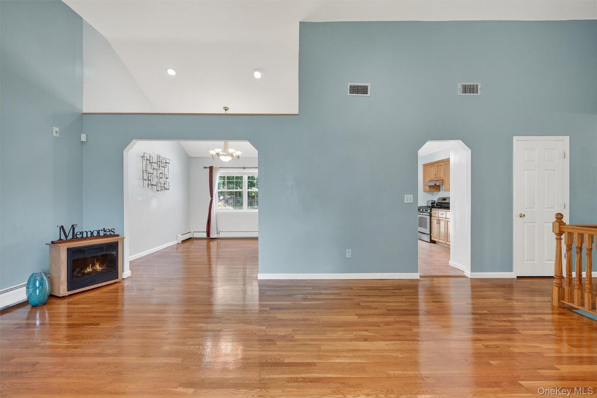 Chandelier, Empty room, Fireplace, Interior, Kitchen, Recessed Lighting, Wood Texture Flooring