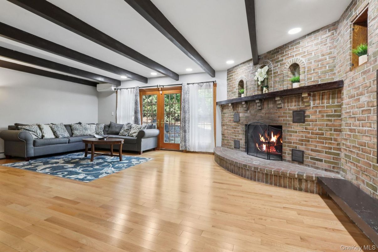 Fireplace, Interior, Living room, Recessed Lighting, Stone Walls, Wooden Beams, Wood Texture Flooring