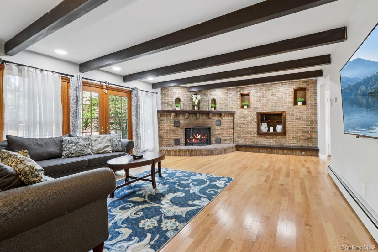 Fireplace, Interior, Living room, Recessed Lighting, Stone Walls, Wooden Beams, Wood Texture Flooring