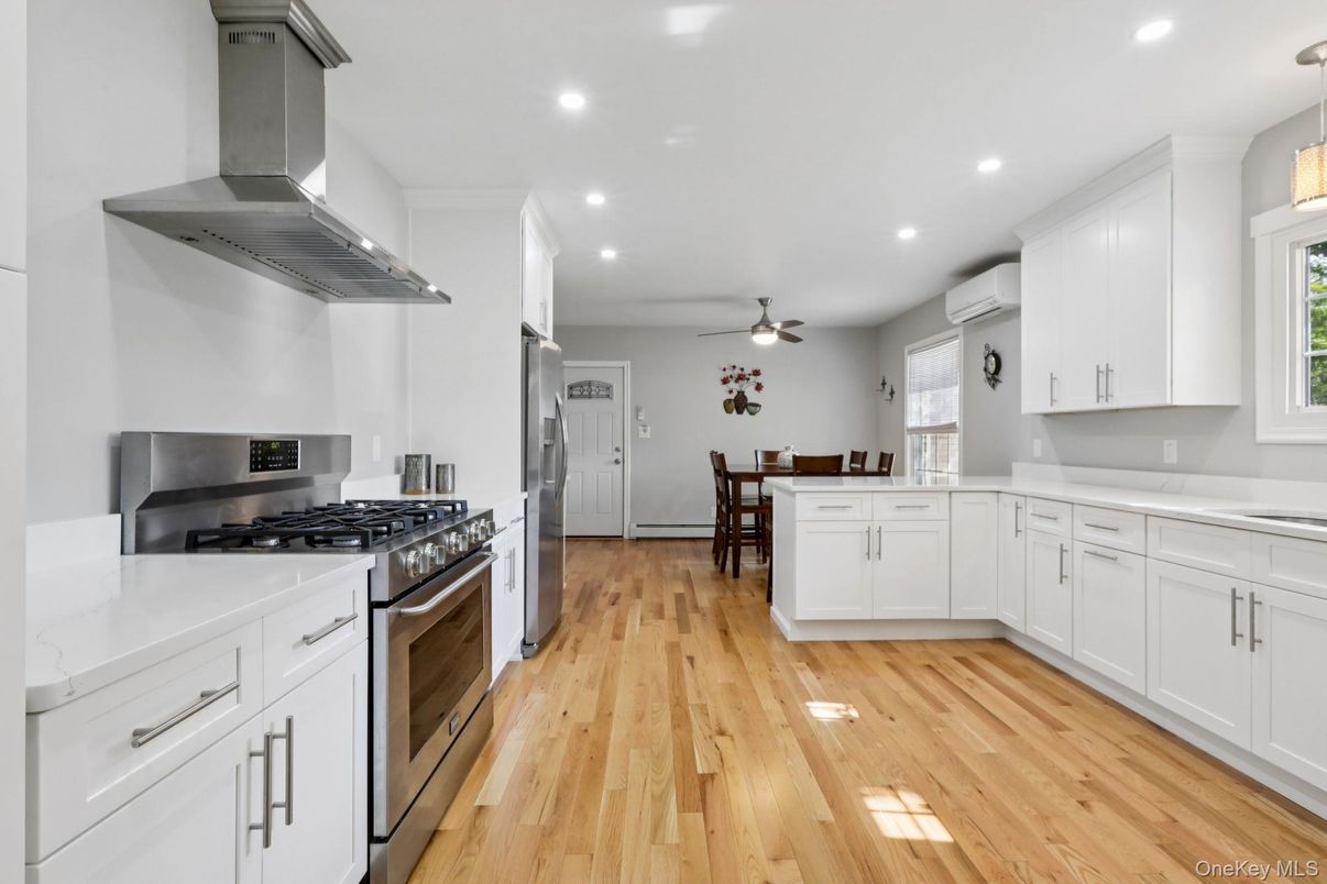 Dining room, Interior, Kitchen, Recessed Lighting, Stainless Steel Appliances, Wood Texture Flooring