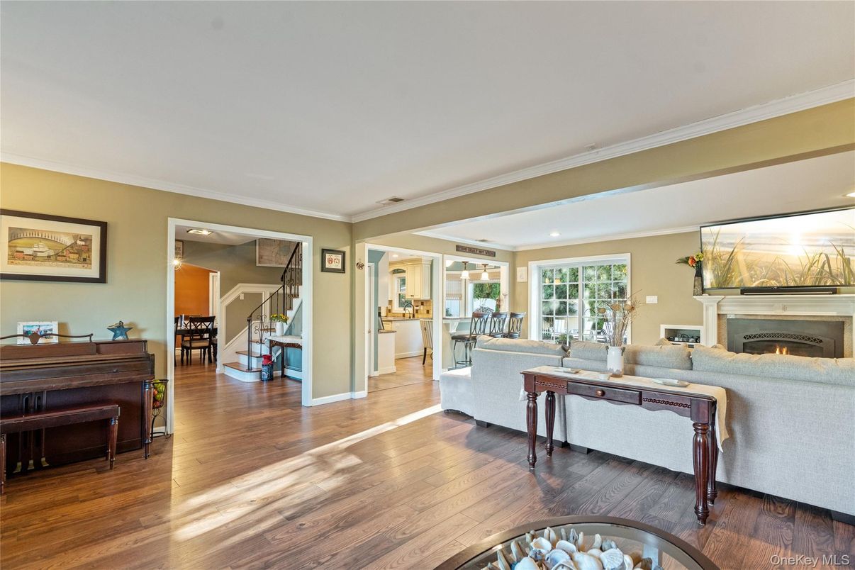 Fireplace, Interior, Living room, Piano, Recessed Lighting, Wood Texture Flooring