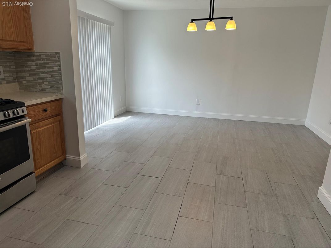 Empty room, Interior, Kitchen, Stainless Steel Appliances, Wood Texture Flooring
