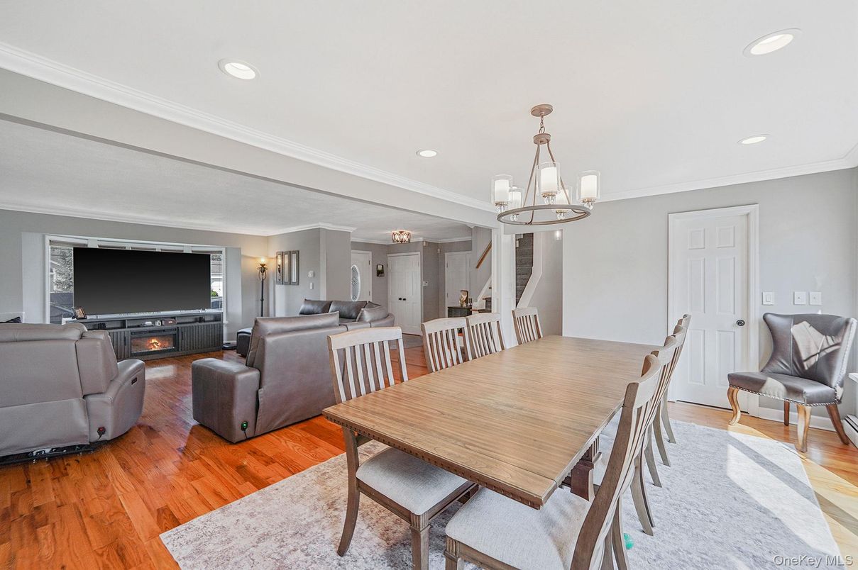 Chandelier, Dining room, Fireplace, Interior, Living room, Recessed Lighting, Wood Texture Flooring