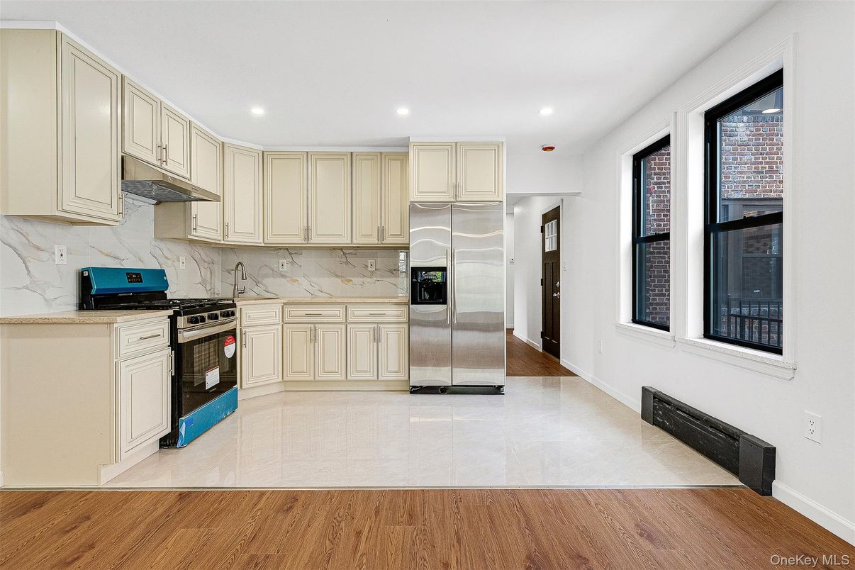 Interior, Kitchen, Marble Walls, Recessed Lighting, Stainless Steel Appliances, Wood Texture Flooring