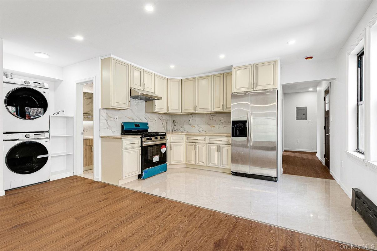 Interior, Kitchen, Recessed Lighting, Stainless Steel Appliances, Washer, Wood Texture Flooring